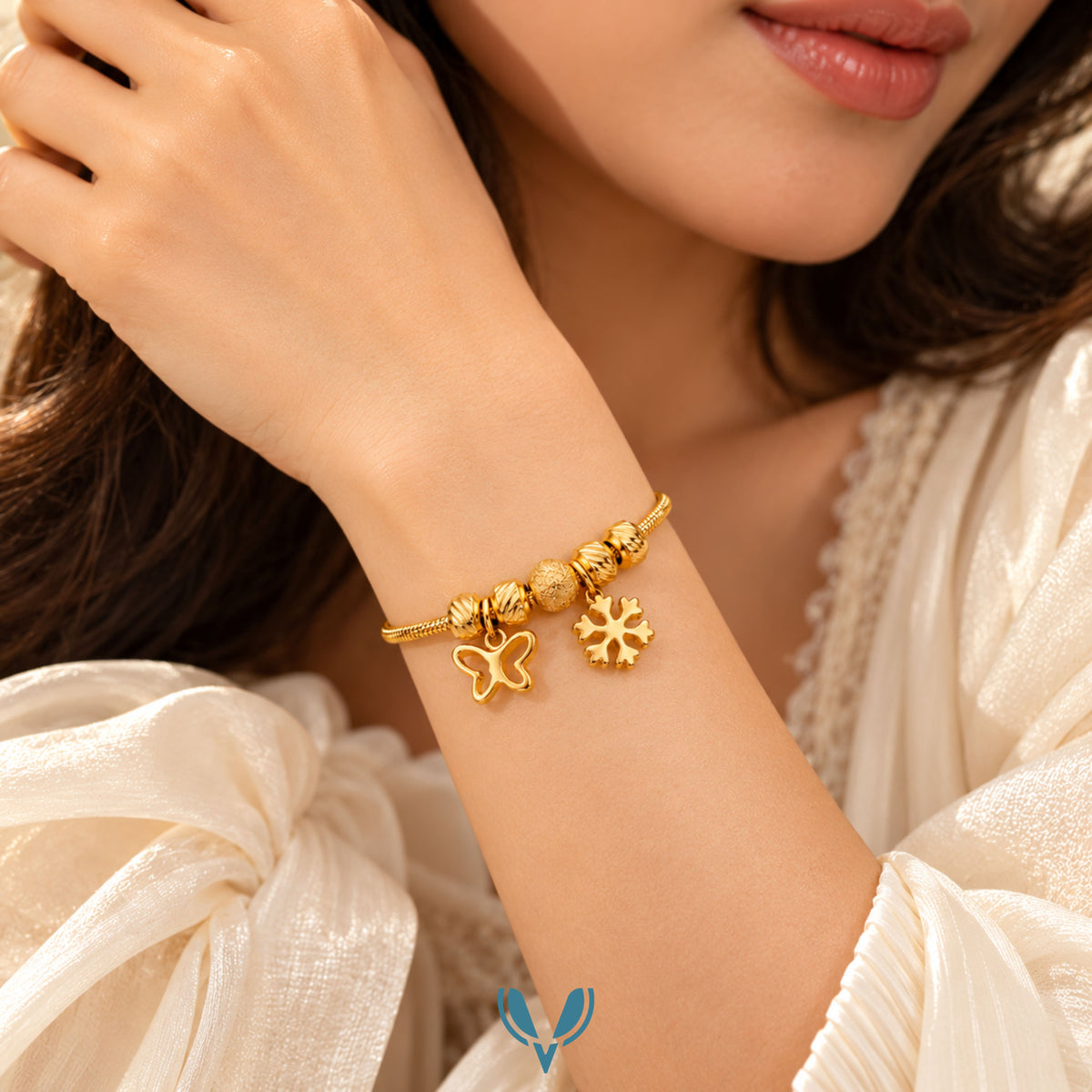Gold Butterfly & Snowflake Charm Bracelet