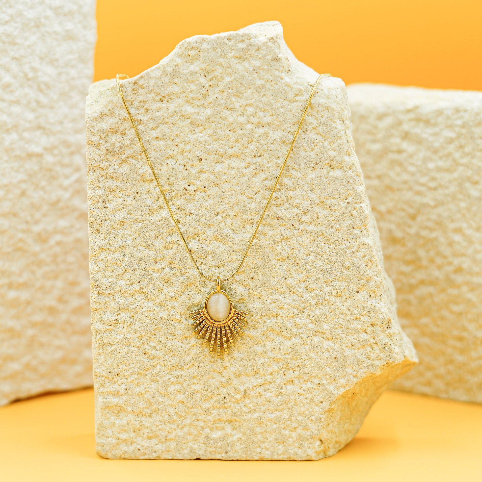 Elegant Gold Sunburst Pendant Necklace with Oval Stone Vellura Jewellery