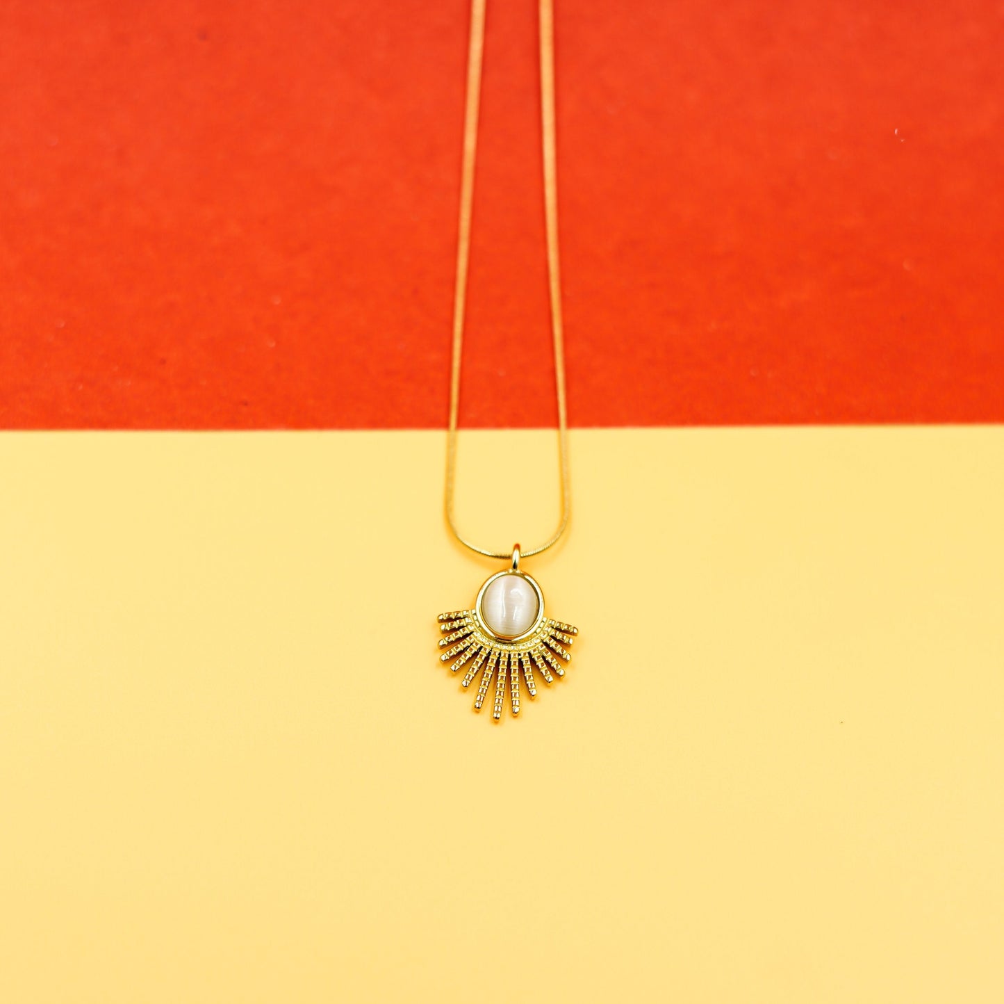 Elegant Gold Sunburst Pendant Necklace with Oval Stone Vellura Jewellery