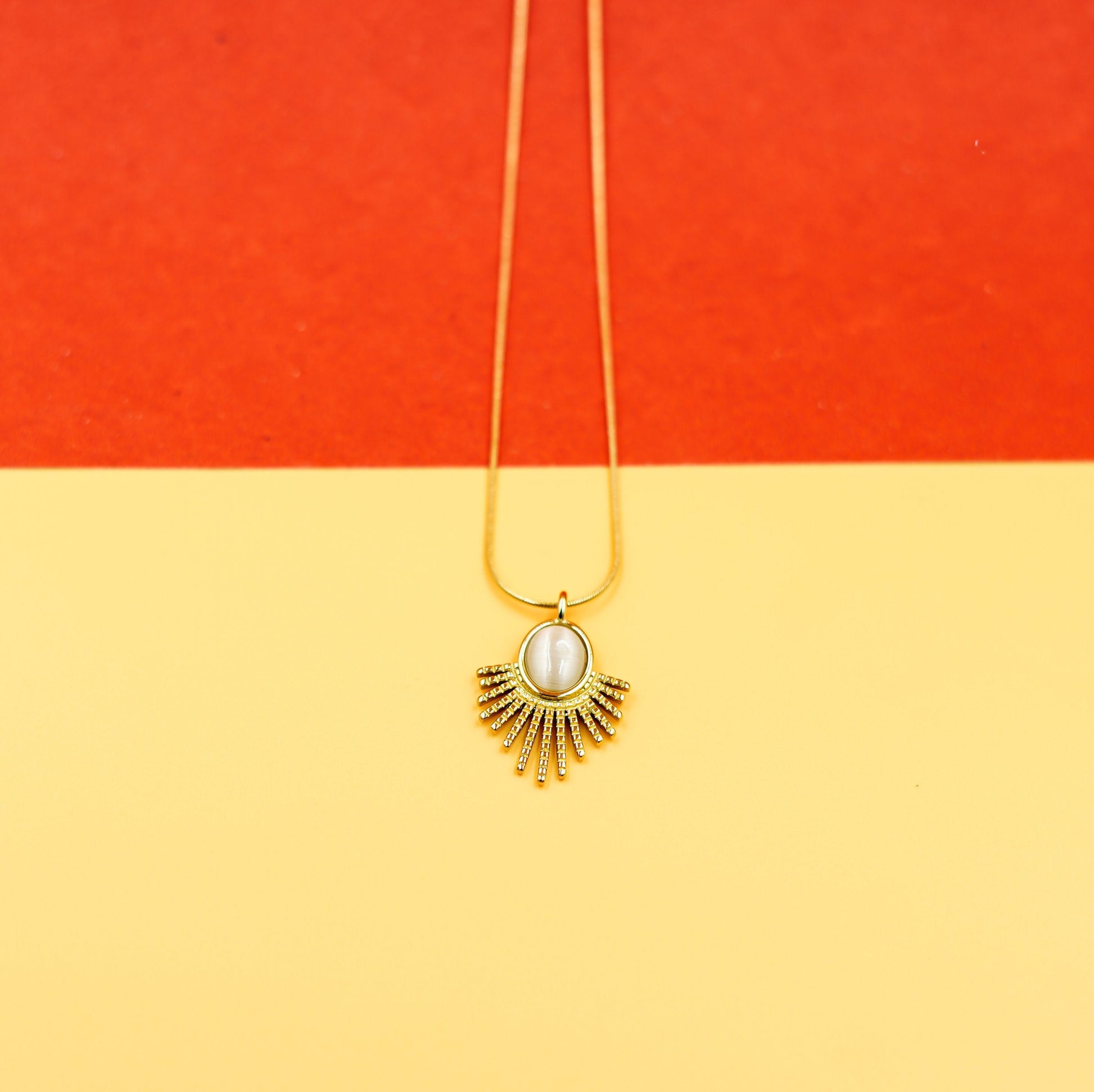 Elegant Gold Sunburst Pendant Necklace with Oval Stone Vellura Jewellery