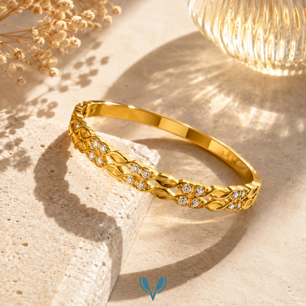 Gold double vine leaf crystal bangle in sunlight