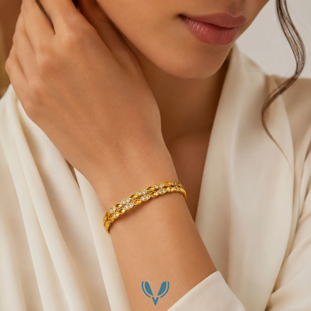 Model wearing gold double vine crystal bangle